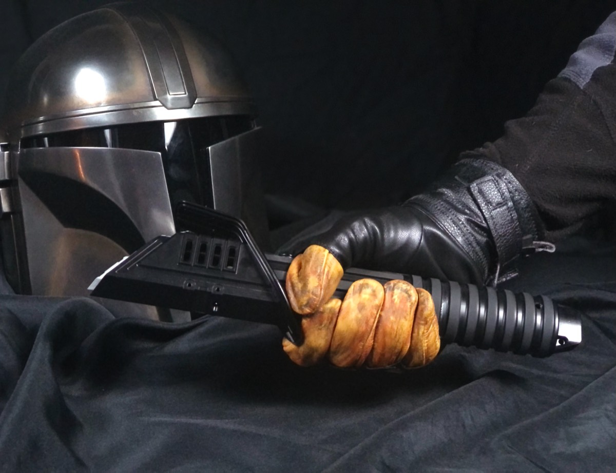 The Mandalorian holding custom Darksaber prop machined by Hooper Machine & Desig